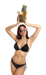 Photo of Beautiful woman in stylish bikini holding tropical cocktail on white background