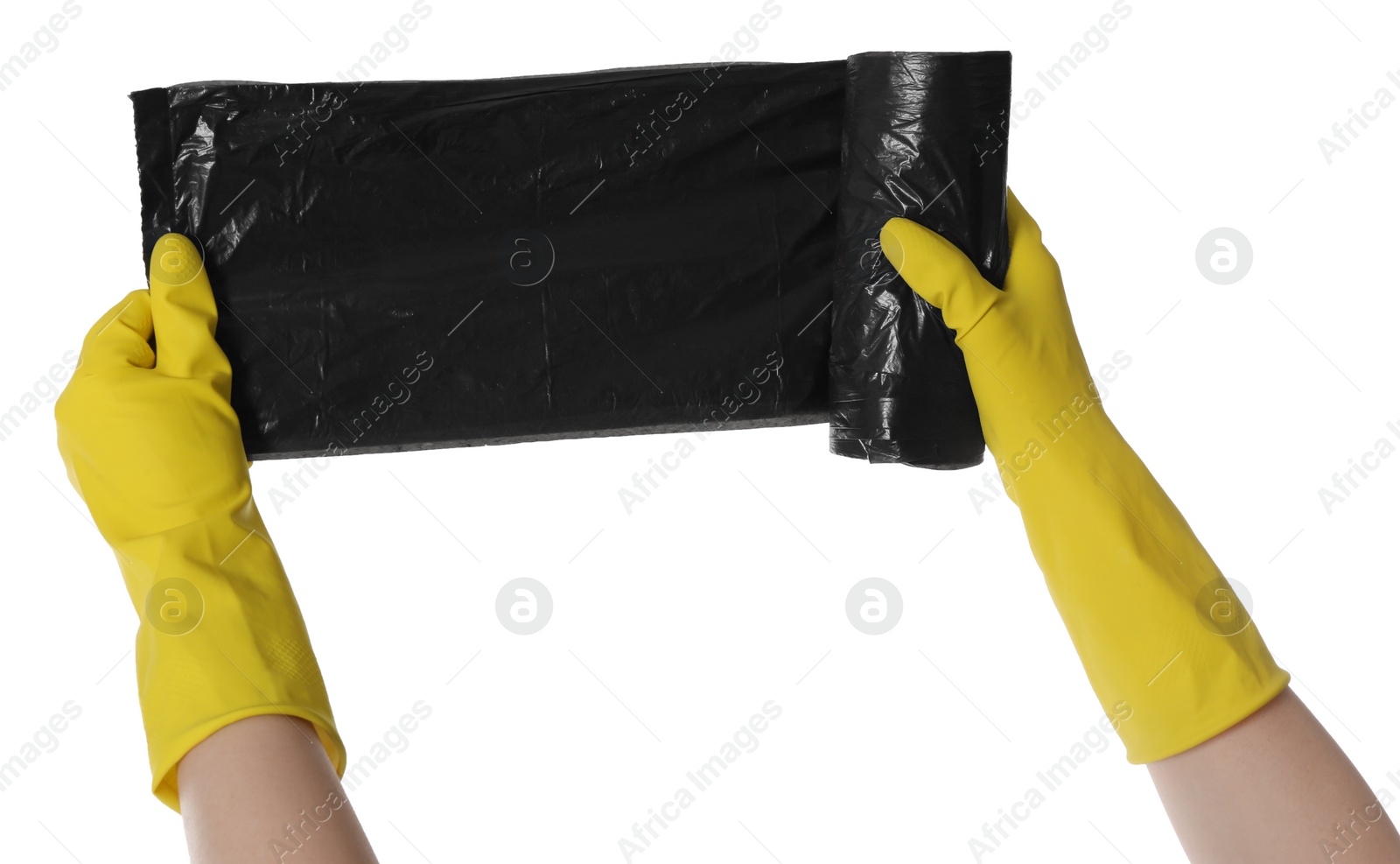 Photo of Janitor in rubber gloves holding roll of black garbage bags on white background, closeup