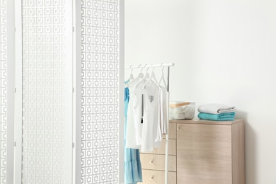 Photo of Modern folding screen in stylish room interior