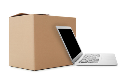 Online selling. Laptop and parcel on white background