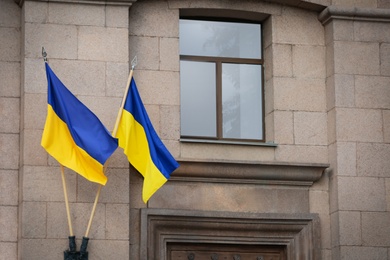 Photo of National flags of Ukraine on building facade