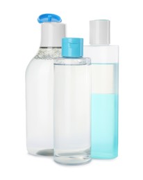 Photo of Bottles of micellar cleansing water on white background