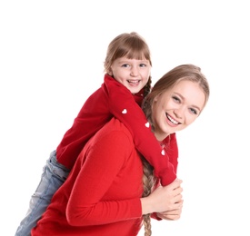 Happy woman and daughter in stylish clothes on white background