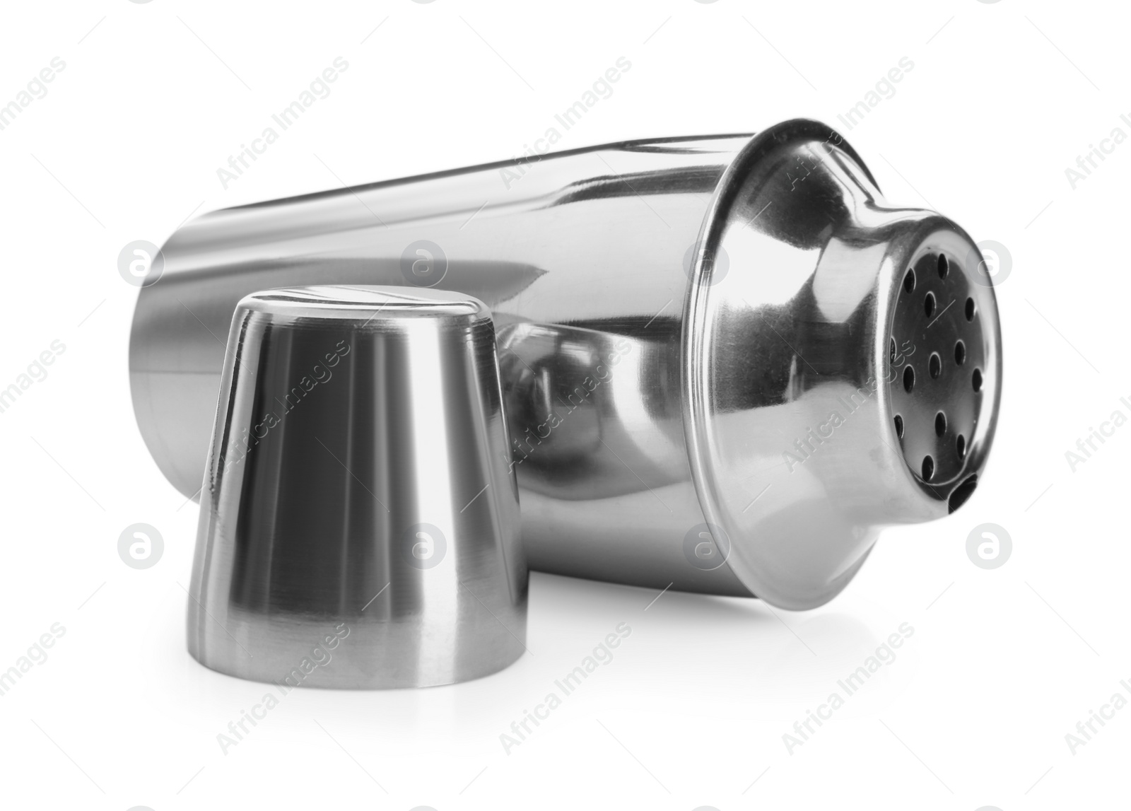 Photo of Metal cocktail shaker and cup isolated on white