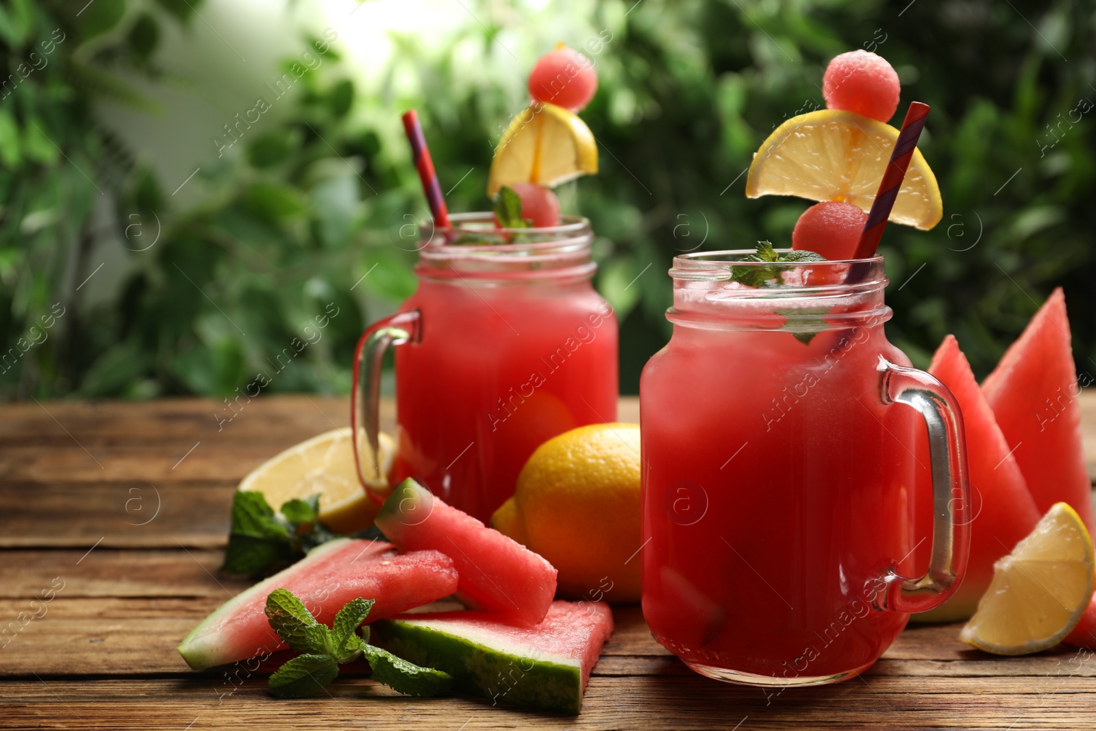 Photo of Delicious fresh watermelon drink on wooden table