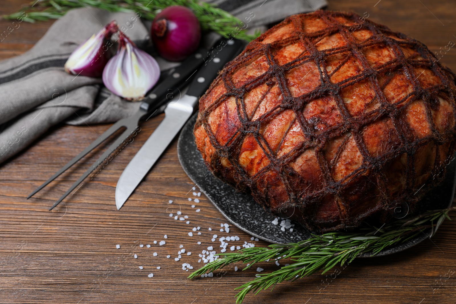 Photo of Delicious baked ham served on wooden table, space for text