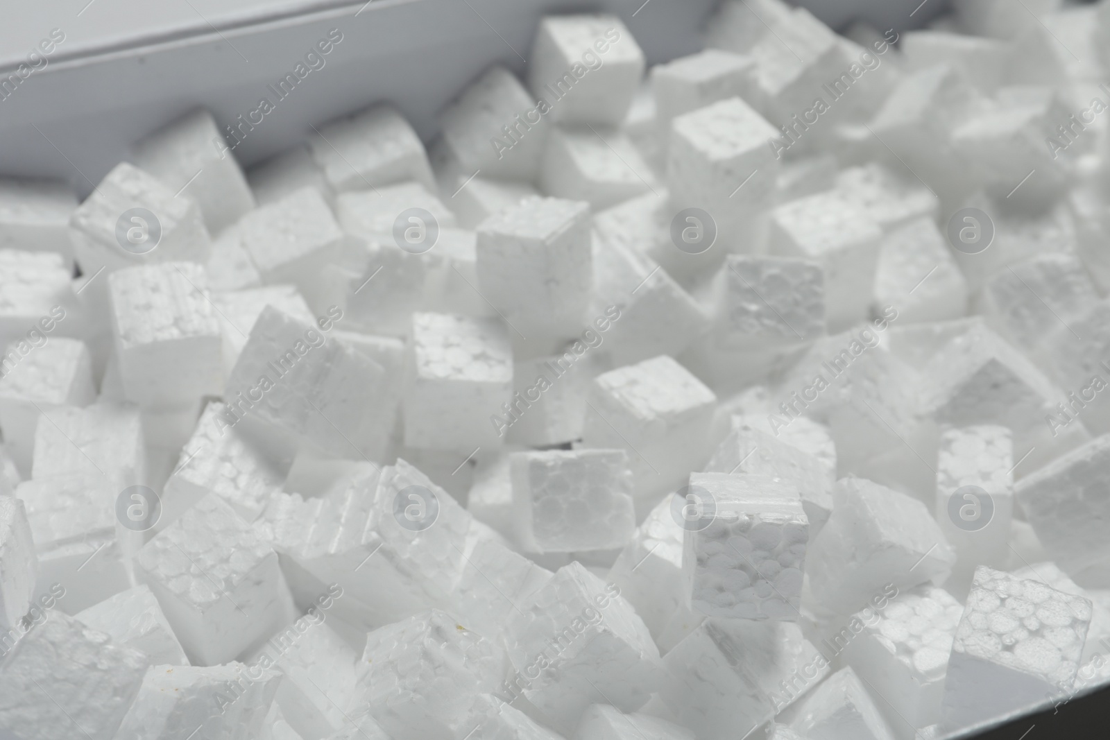 Photo of Closeup view of cardboard box with styrofoam cubes