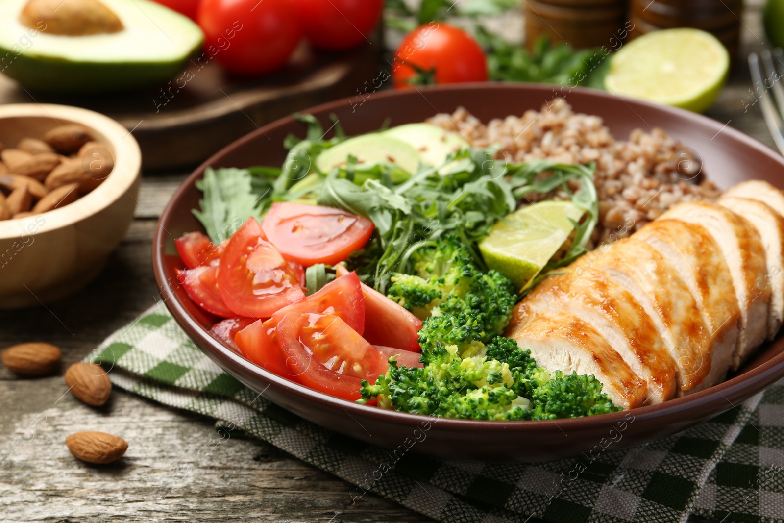 Photo of Healthy meal. Tasty products in bowl on wooden table, closeup