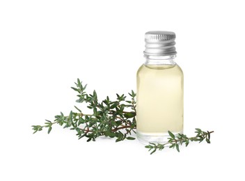 Photo of Bottle of thyme essential oil and fresh plant isolated on white