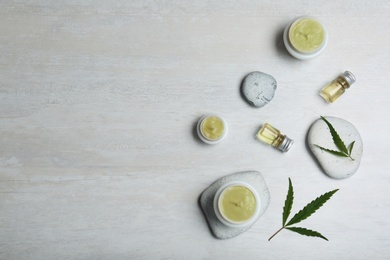 Photo of Flat lay composition with hemp lotion on light background