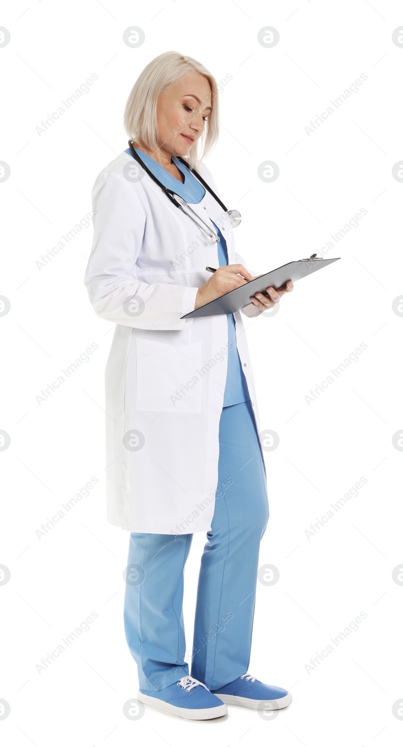 Photo of Full length portrait of female doctor with clipboard isolated on white. Medical staff