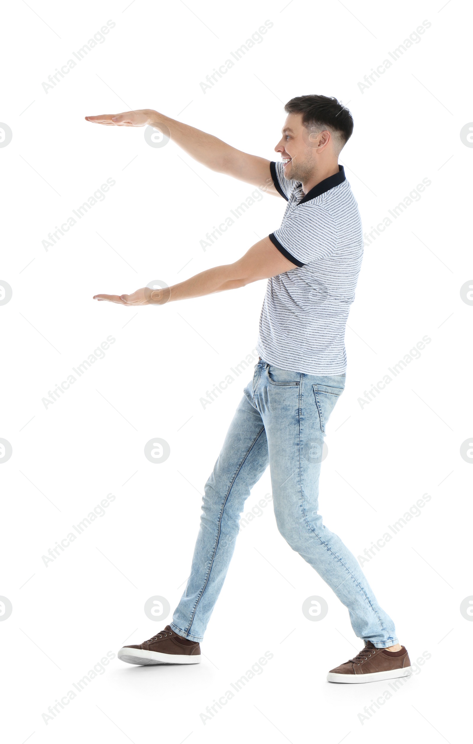 Photo of Man in casual clothes holding something on white background