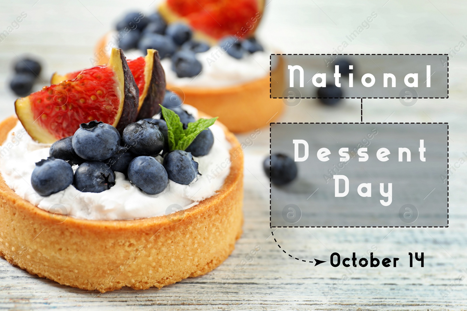 Image of National Dessert Day, October 14. Tasty tartlets with blueberries and figs on white wooden table, closeup