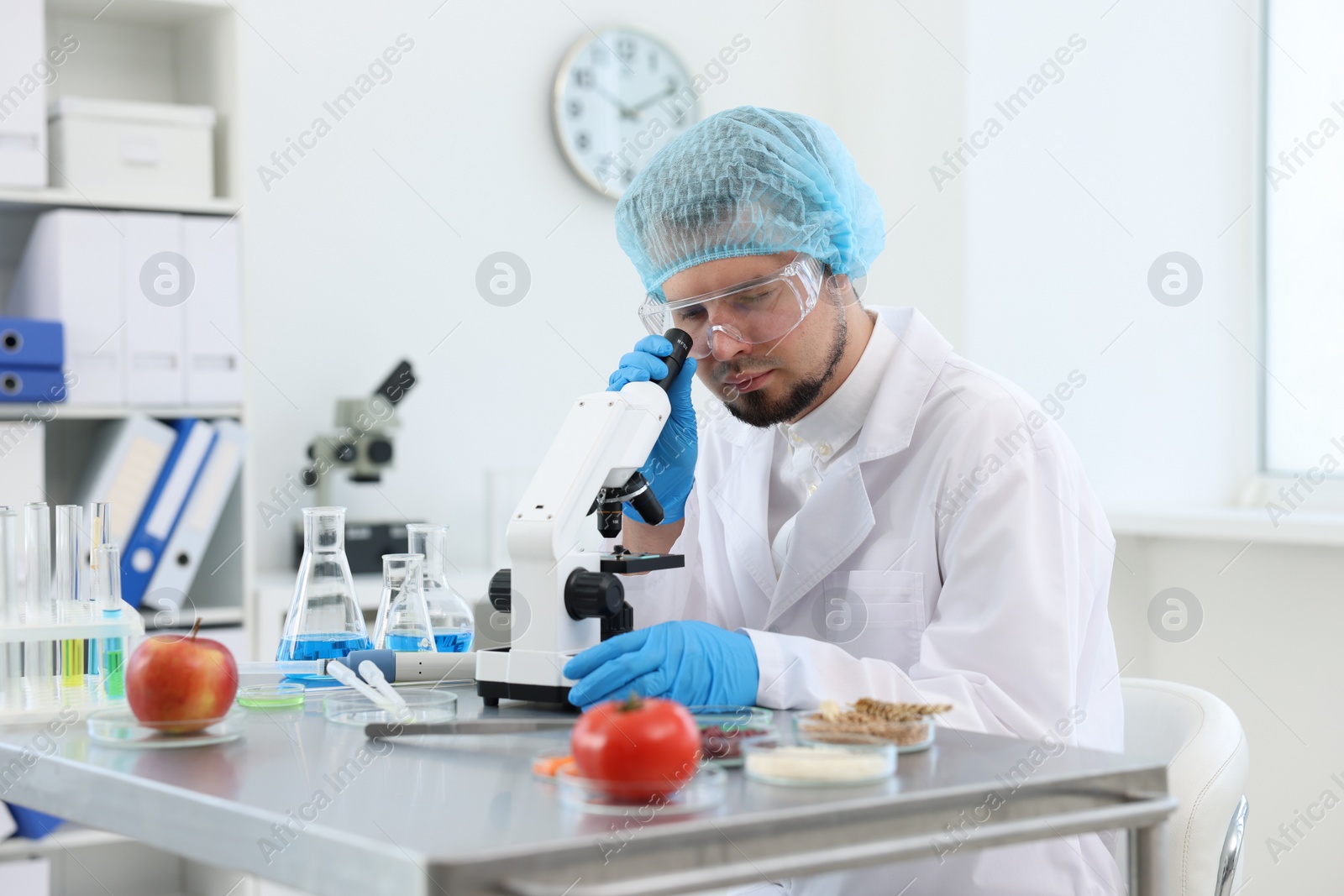 Photo of Quality control. Food inspector checking safety of products in laboratory