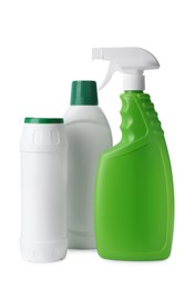 Bottles with different detergents on white background. Cleaning supplies