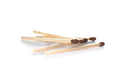 Photo of Several whole wooden matches on white background