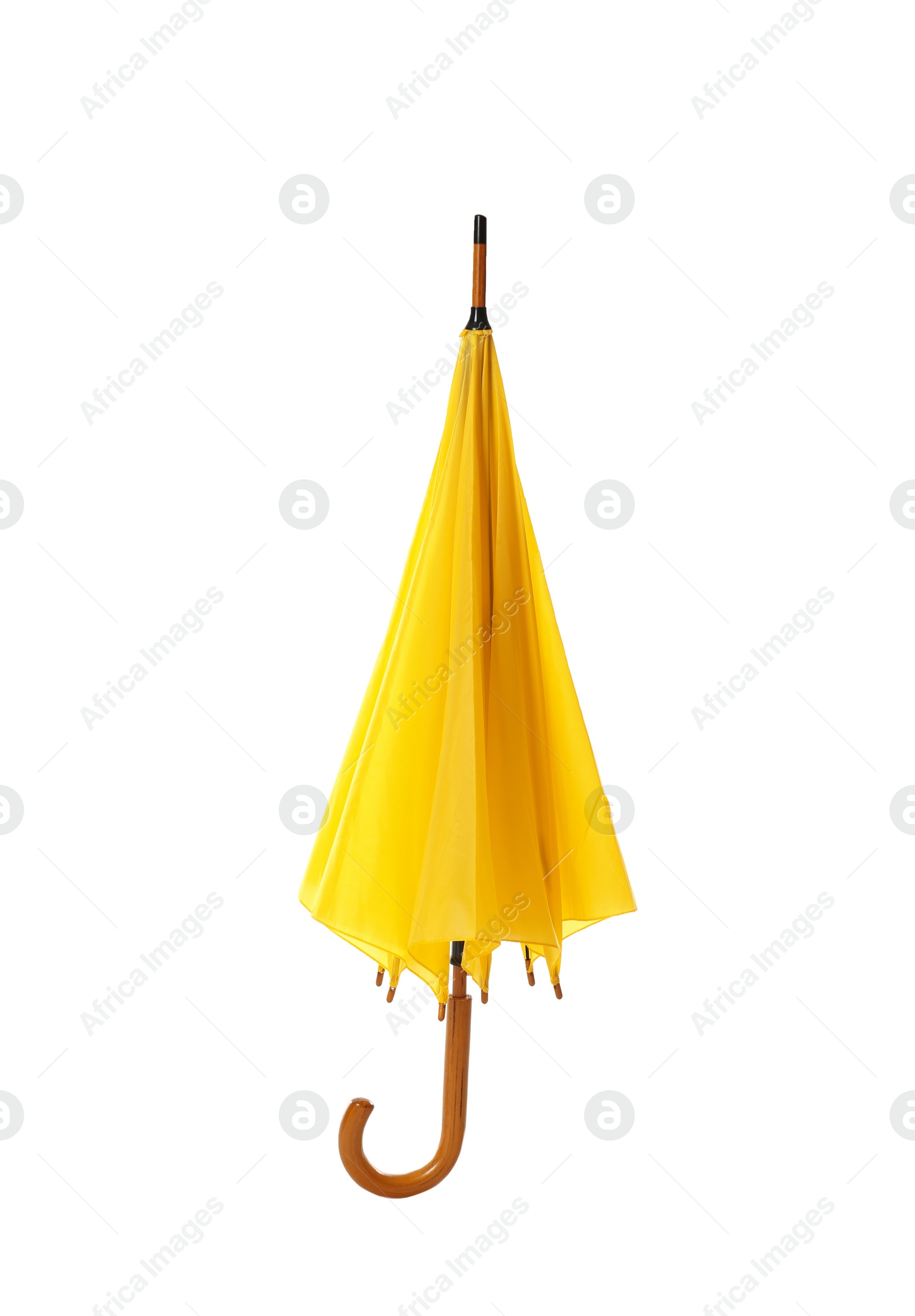 Photo of Modern closed yellow umbrella isolated on white