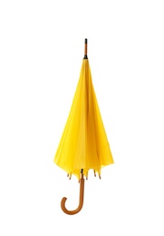 Photo of Modern closed yellow umbrella isolated on white