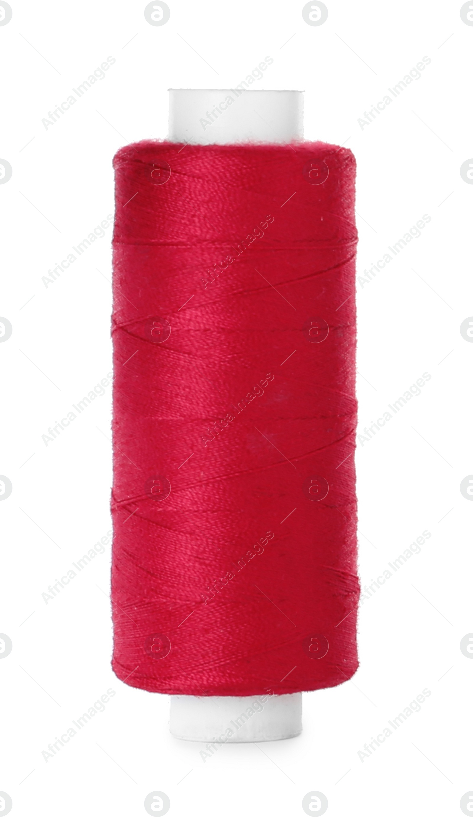 Photo of Spool of red sewing thread isolated on white