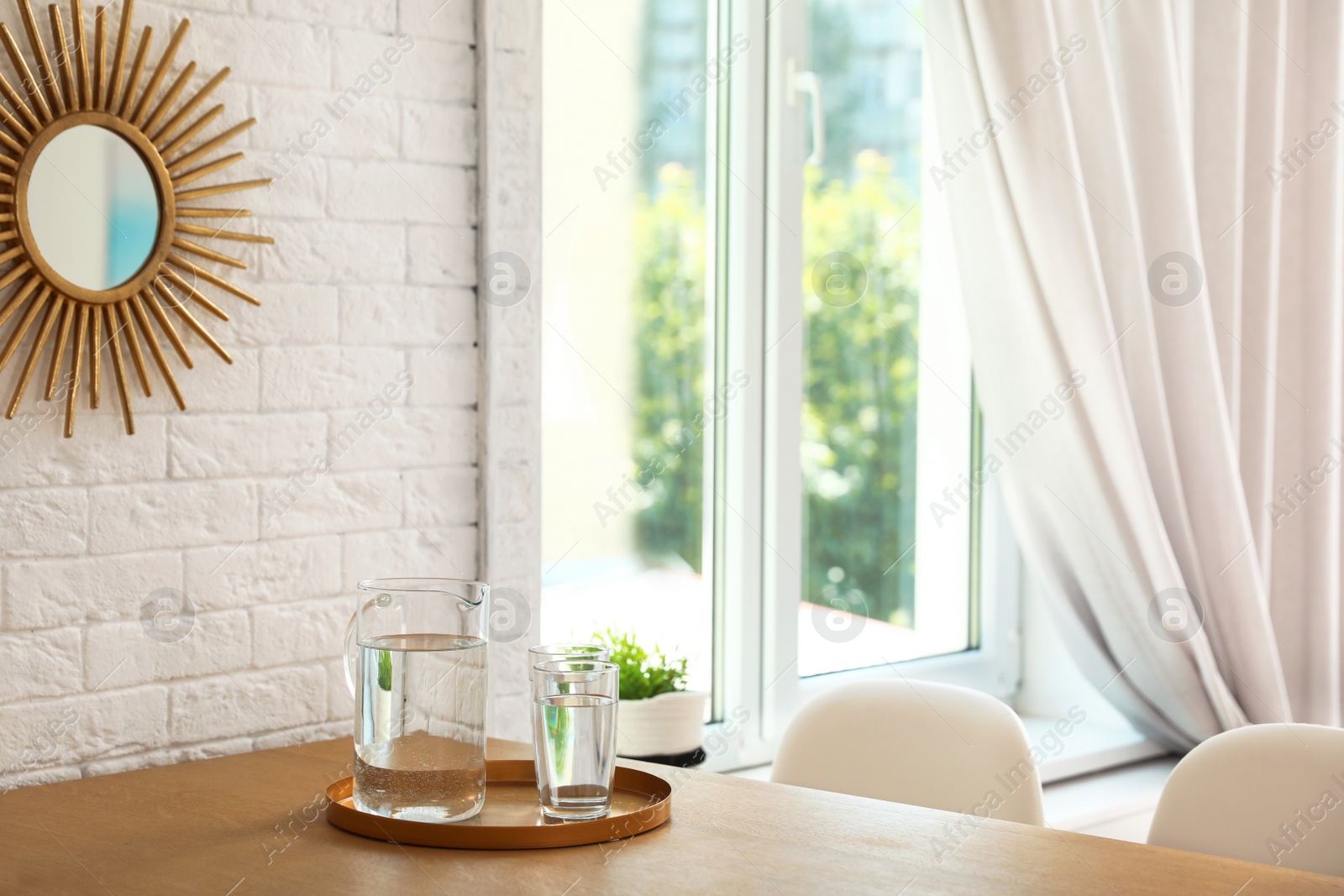 Photo of Wooden dining table in modern room interior