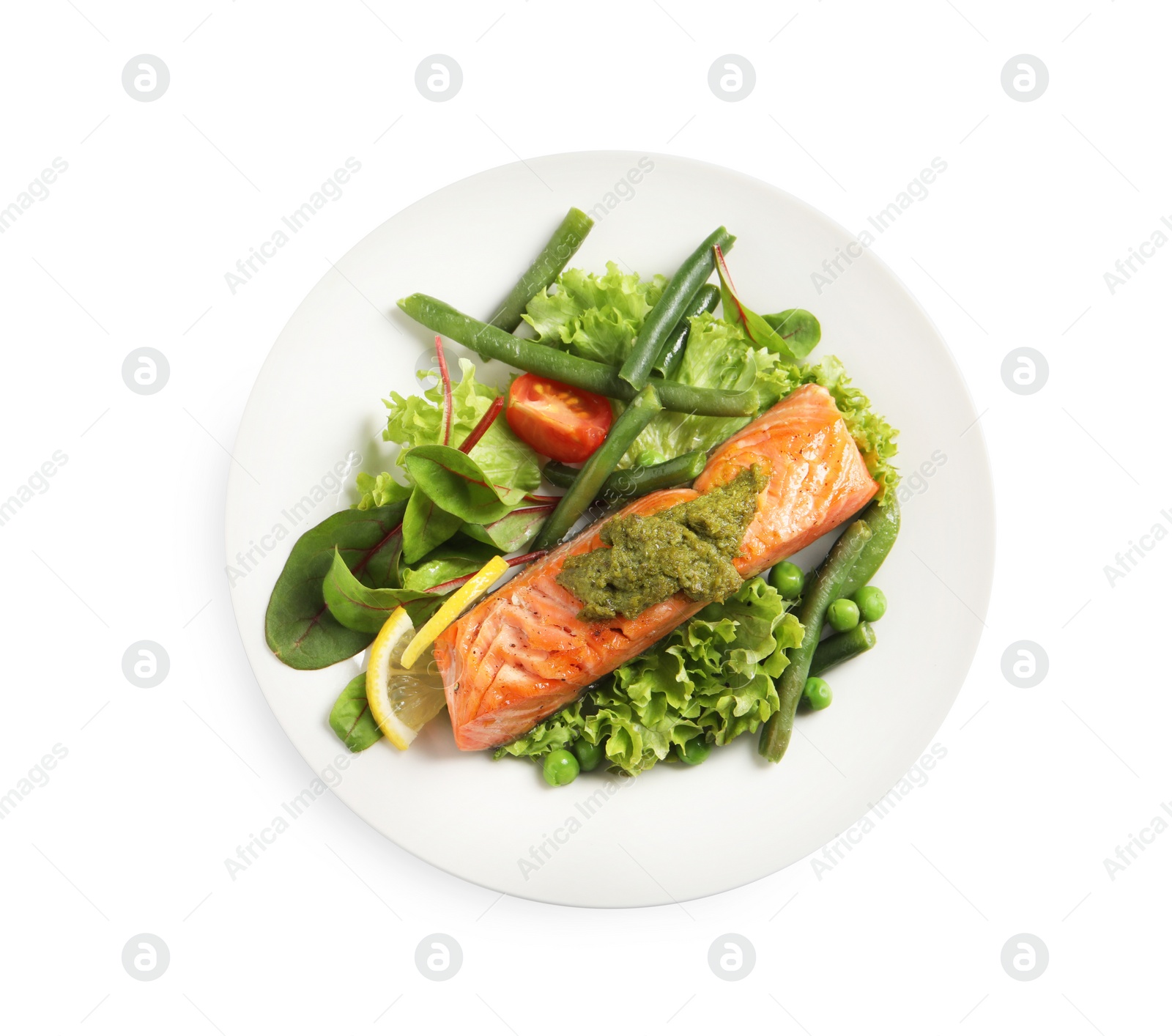 Photo of Tasty cooked salmon with pesto sauce and fresh salad on white background, top view