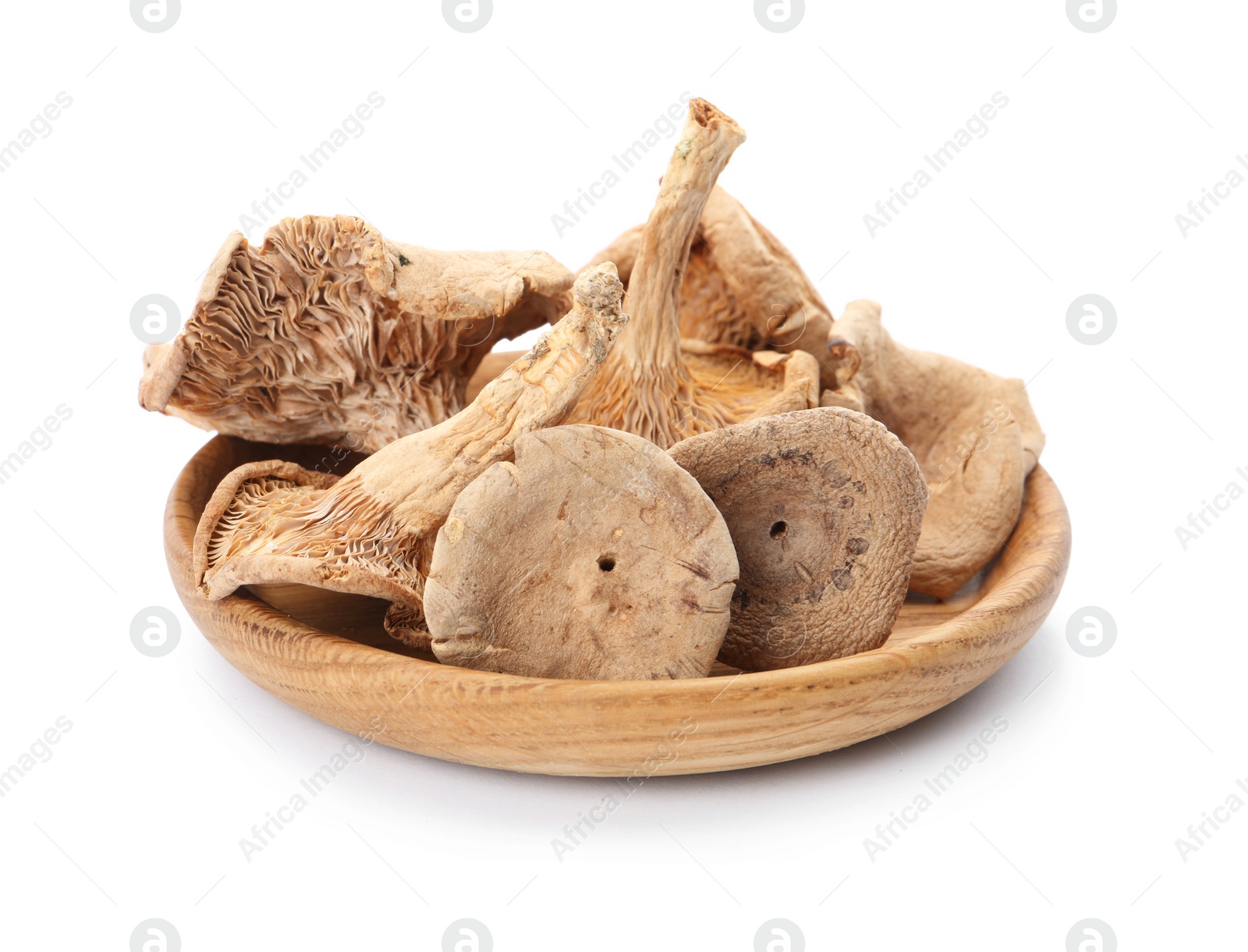 Photo of Plate of tasty dried mushrooms isolated on white