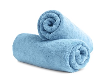 Rolled soft terry towels on white background