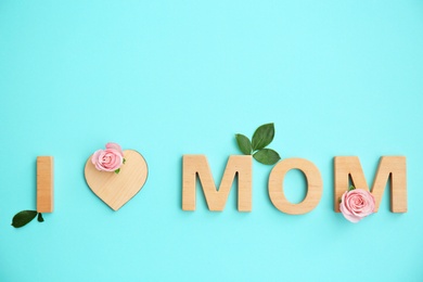 Photo of Phrase "I LOVE MOM" made of letters on color background. Happy Mother's Day