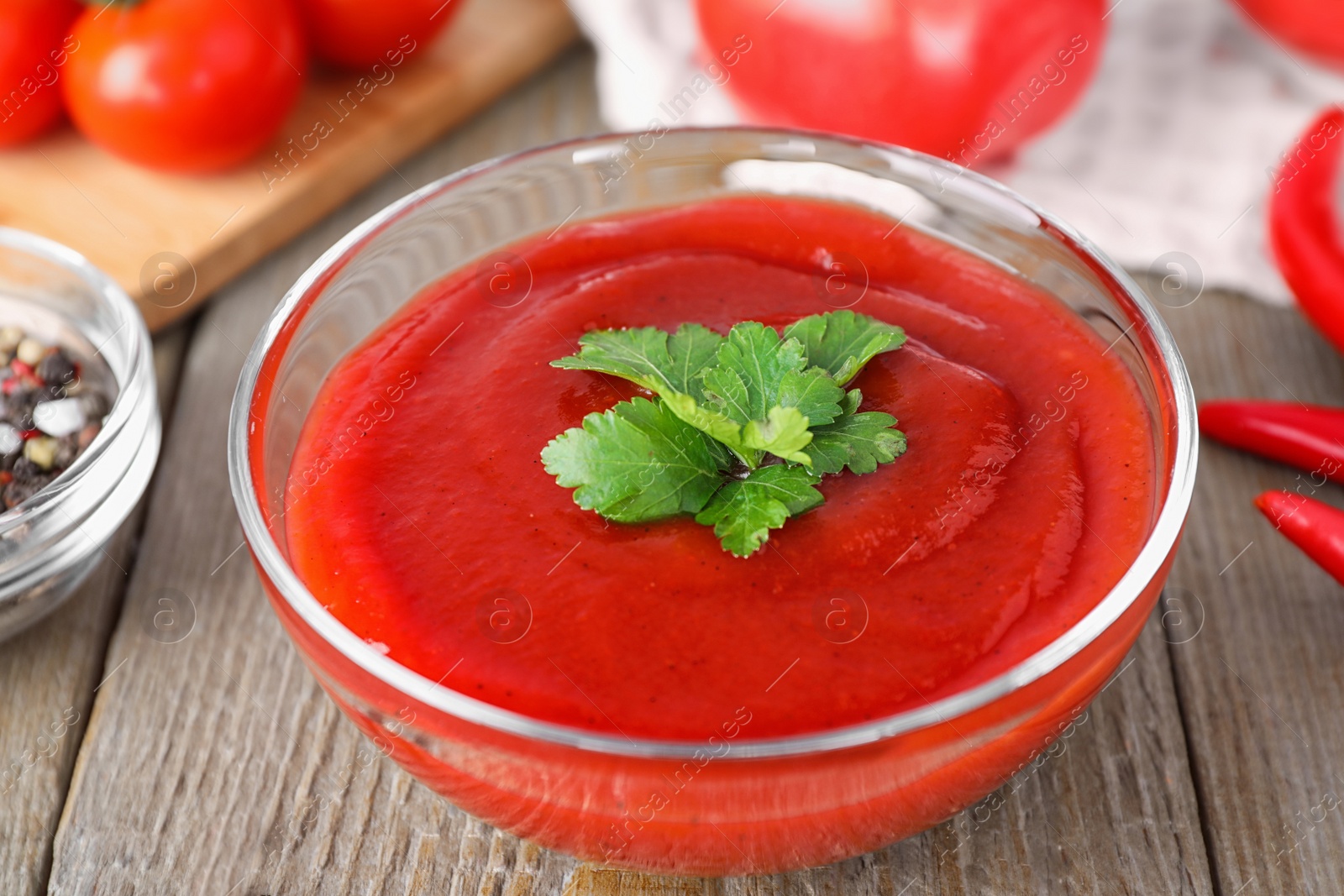 Photo of Delicious fresh tomato sauce on wooden table, closeup