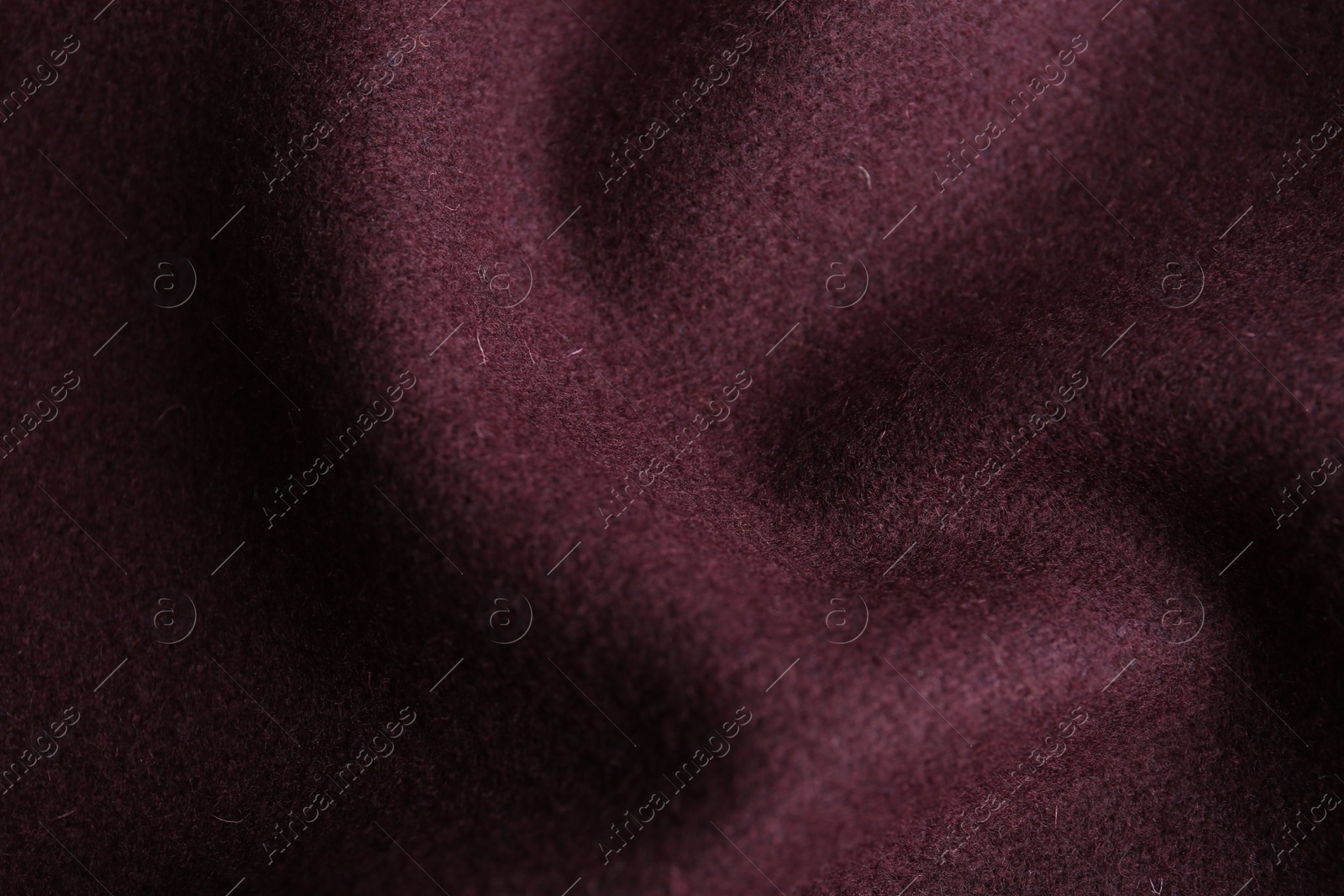 Photo of Texture of beautiful dark red fabric as background, closeup