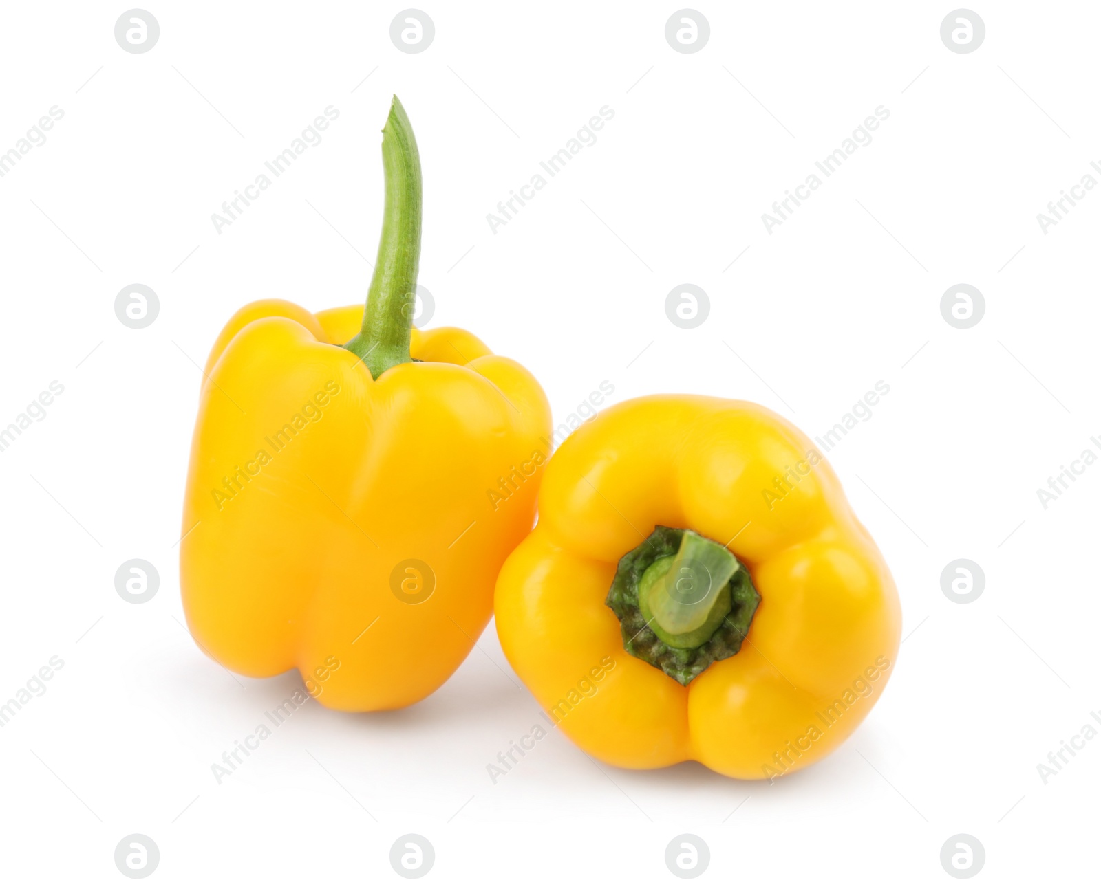 Photo of Ripe yellow bell peppers isolated on white