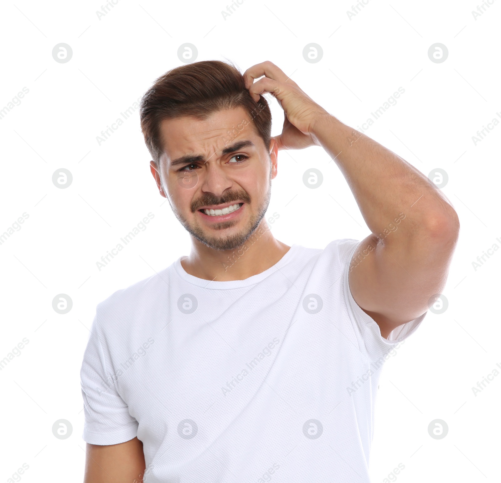 Photo of Young man scratching head on white background. Annoying itch