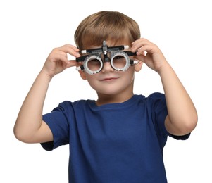 Vision testing. Little boy with trial frame on white background