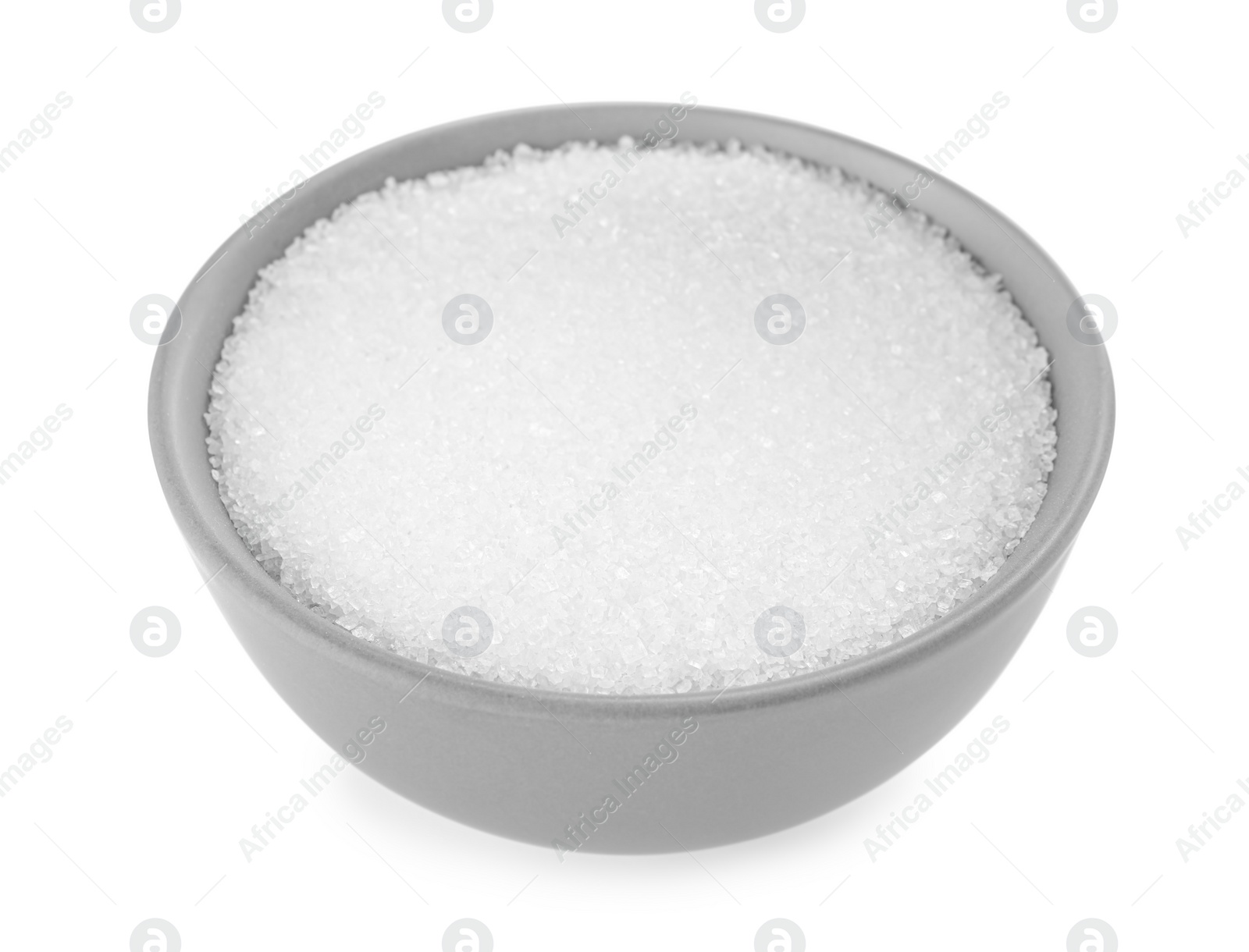 Photo of Granulated sugar in bowl isolated on white