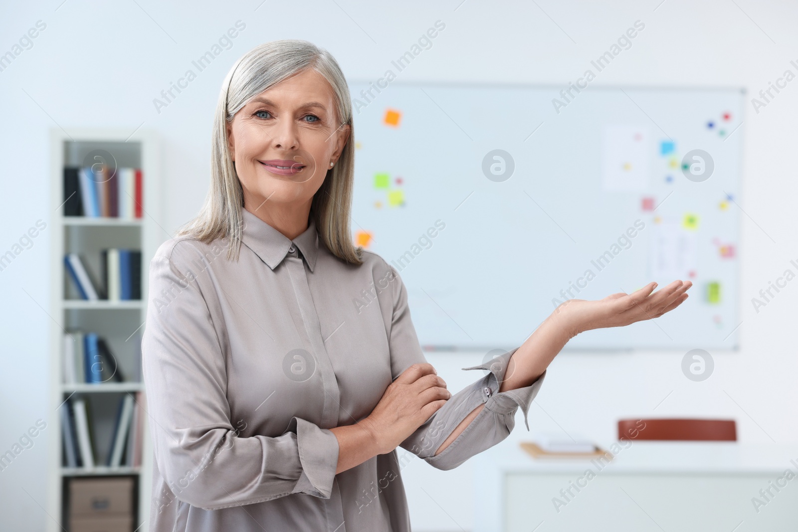 Photo of Portrait of beautiful happy professor in classroom