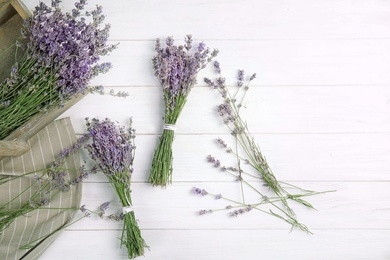 Photo of Flat lay composition with lavender flowers on wooden background