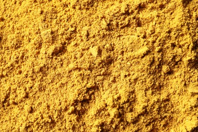 Photo of Dry curry powder as background, top view