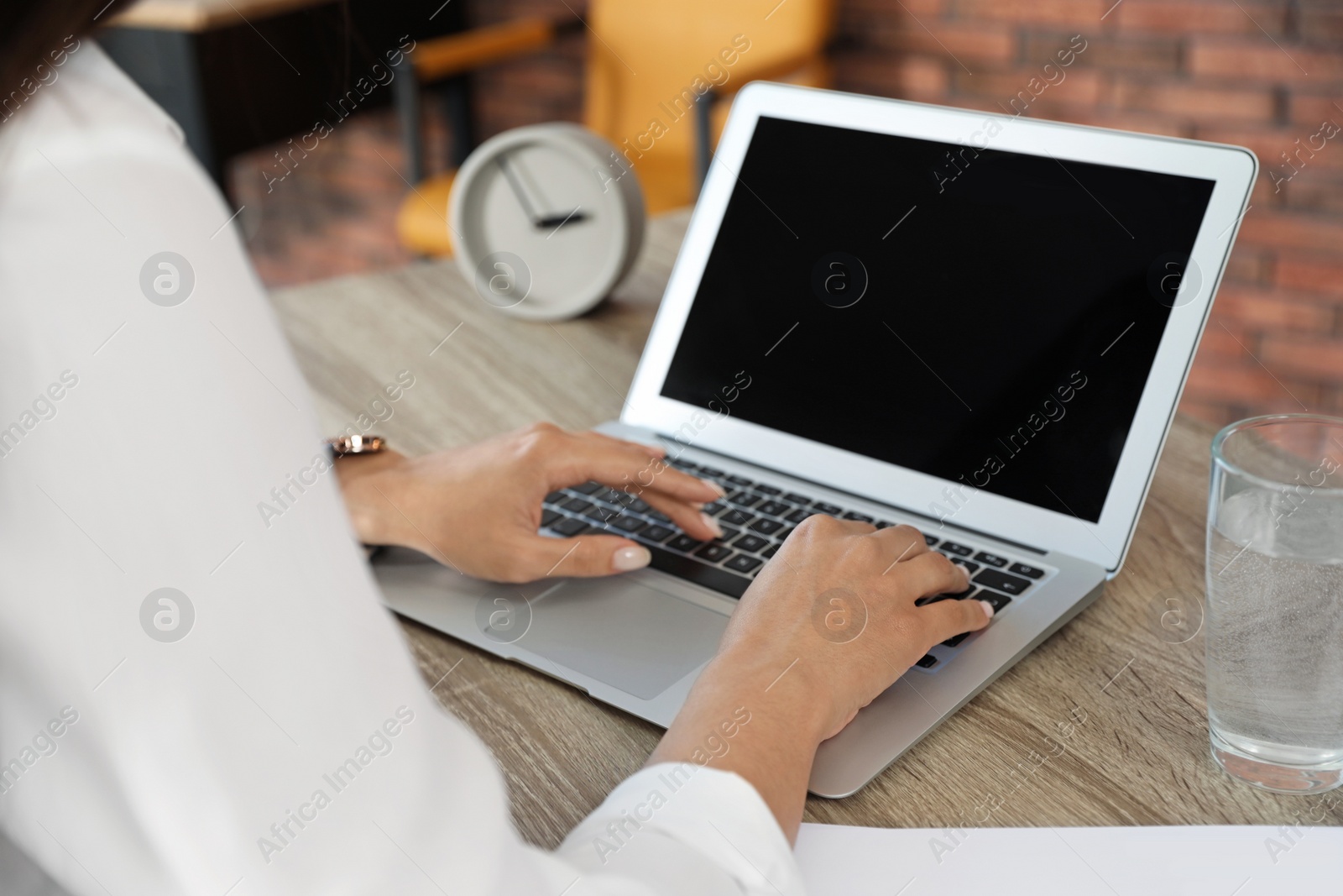 Photo of Woman using video chat on laptop in home office, closeup. Space for text