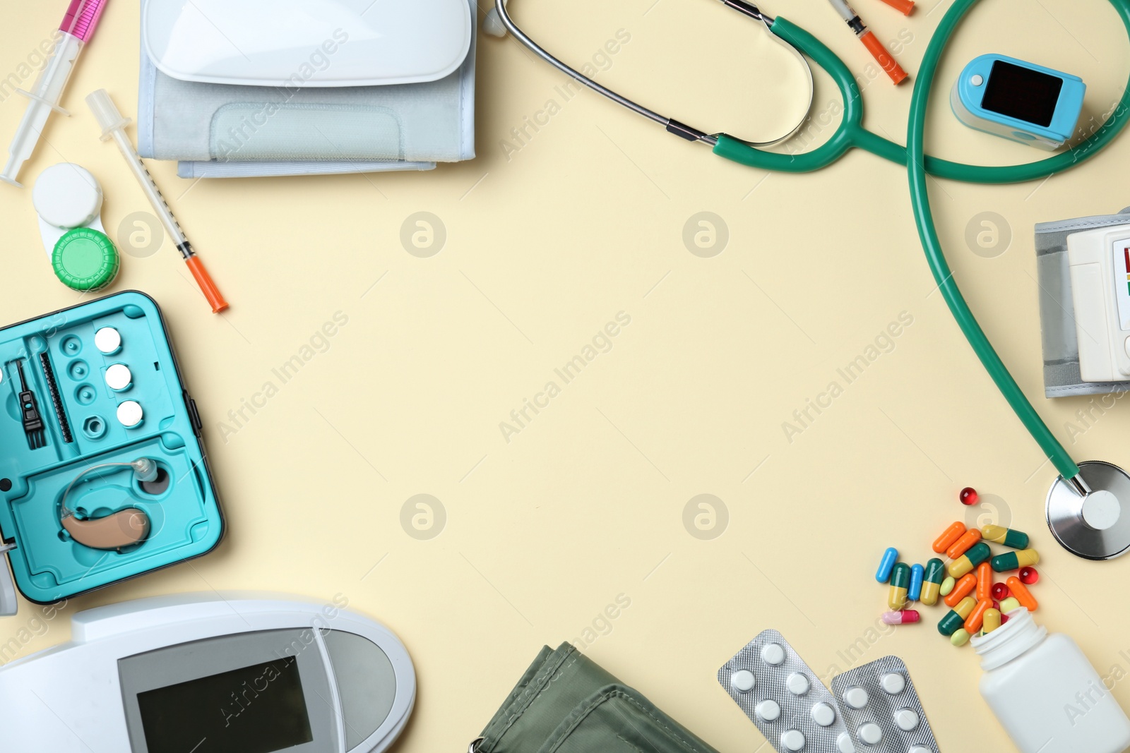 Photo of Flat lay composition with different medical objects and space for text on color background