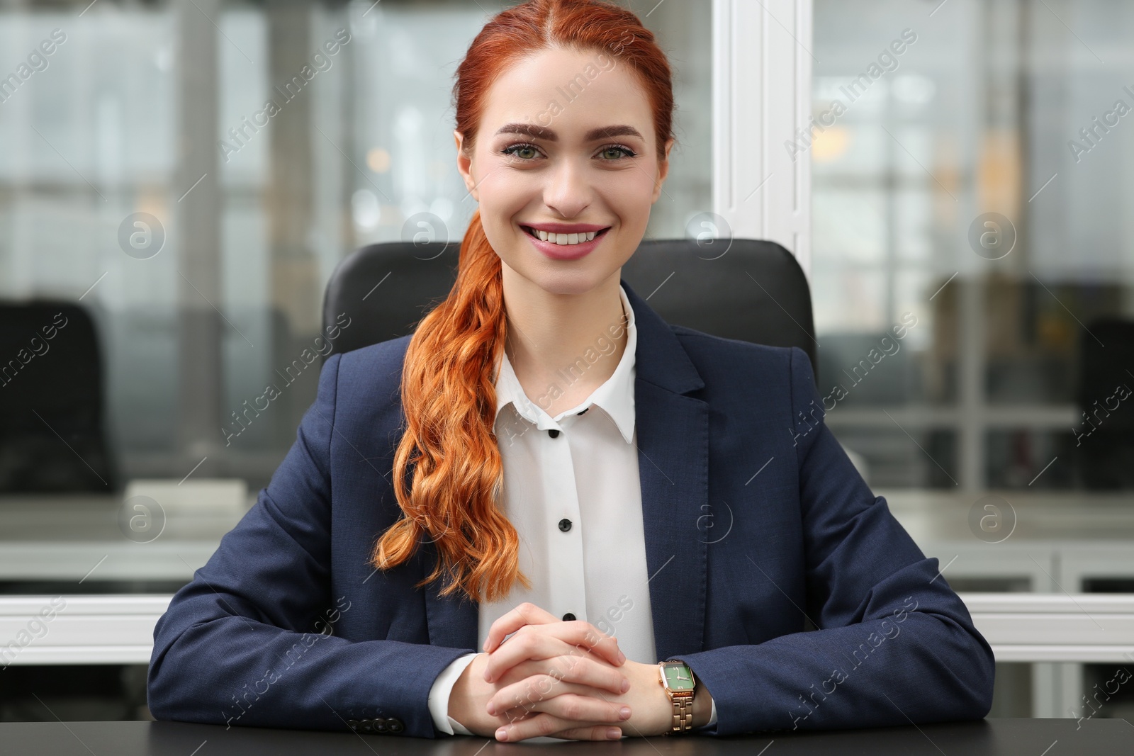 Photo of Happy woman having video call at black desk in office, view from web camera