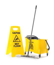 Photo of Safety sign with phrase Caution wet floor, mop and bucket on white background. Cleaning service