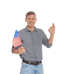 Photo of Portrait of man holding USA flag on white background