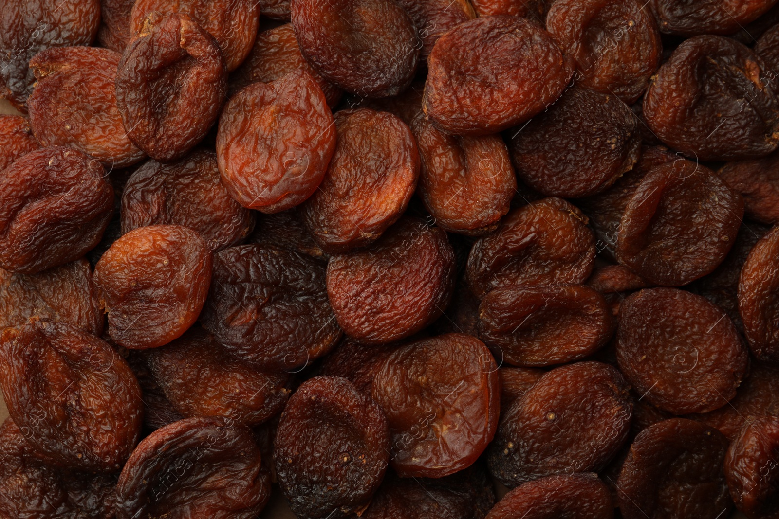 Photo of Tasty dried apricots as background, top view. Healthy snack