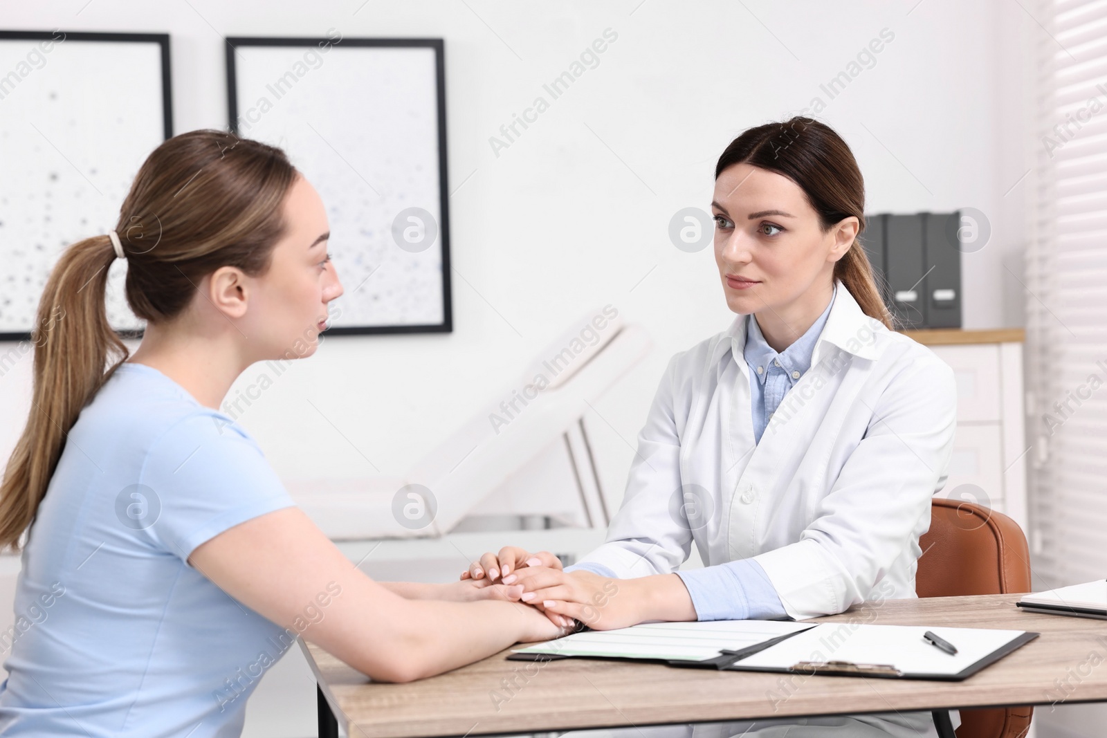 Photo of Mammologist's appointment. Doctor and woman in hospital