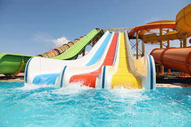 Photo of Colorful slides in water park. Summer vacation