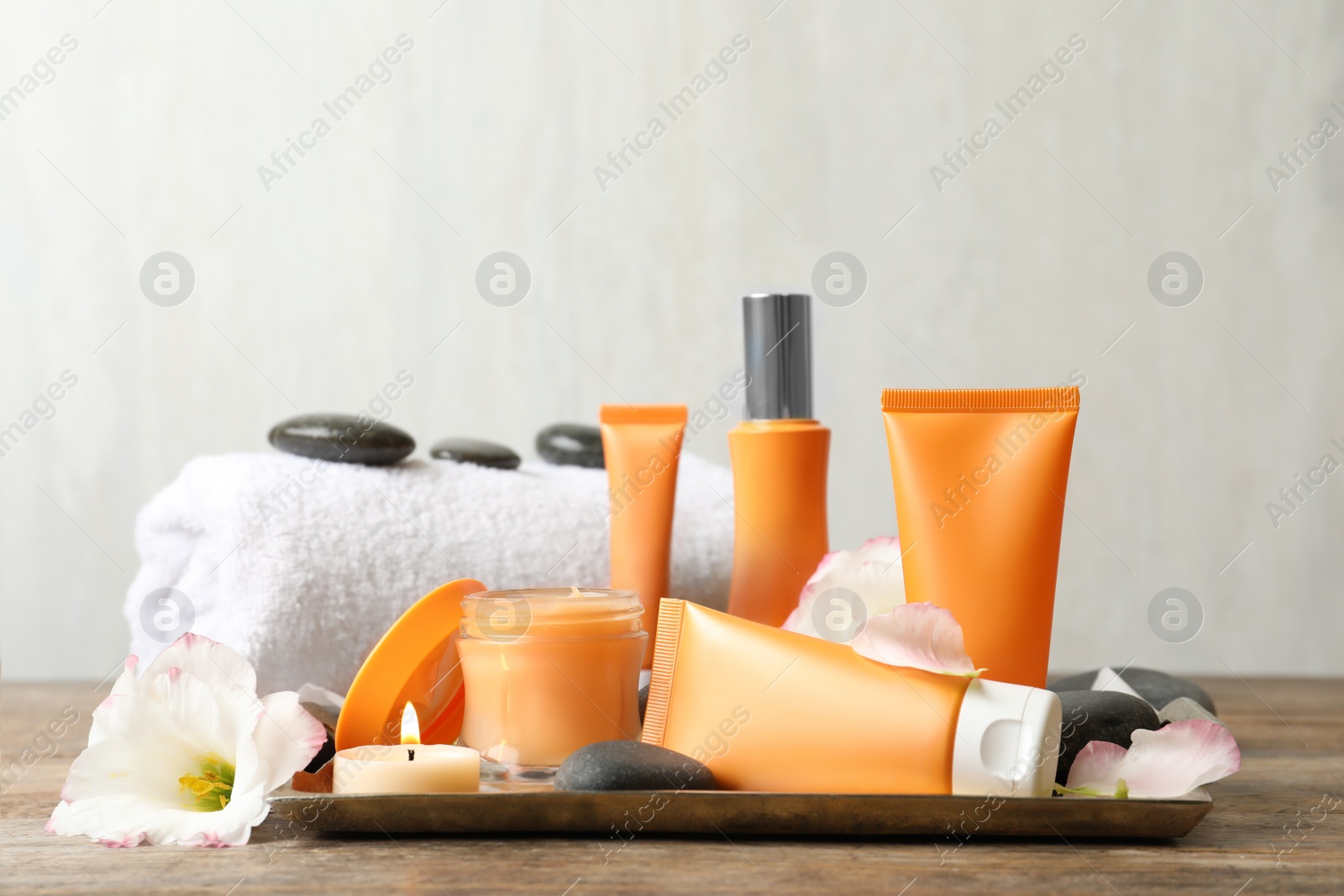Photo of Composition with cosmetic products on wooden table