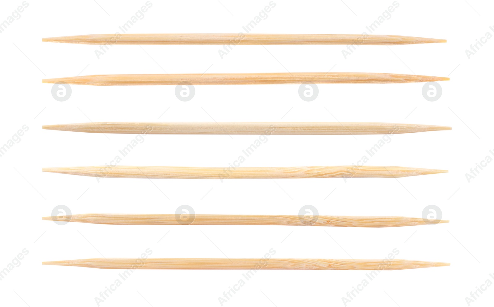 Image of Set with wooden toothpicks on white background