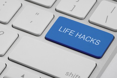 Image of Blue button with words Life Hacks on laptop, closeup