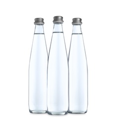 Glass bottles with soda water on white background