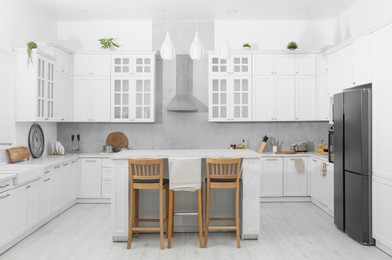 Photo of Beautiful kitchen interior with stylish modern furniture